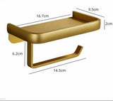 Gold roll holder shelf holding a phone with a toilet roll on the bar below