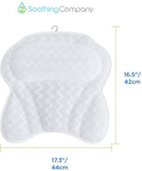 White bath pillow hanging to dry beside a freestanding bath