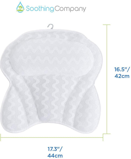 White bath pillow hanging to dry beside a freestanding bath