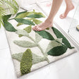 Microfibre bath mat 50 x 80 cm with a green leaf print design