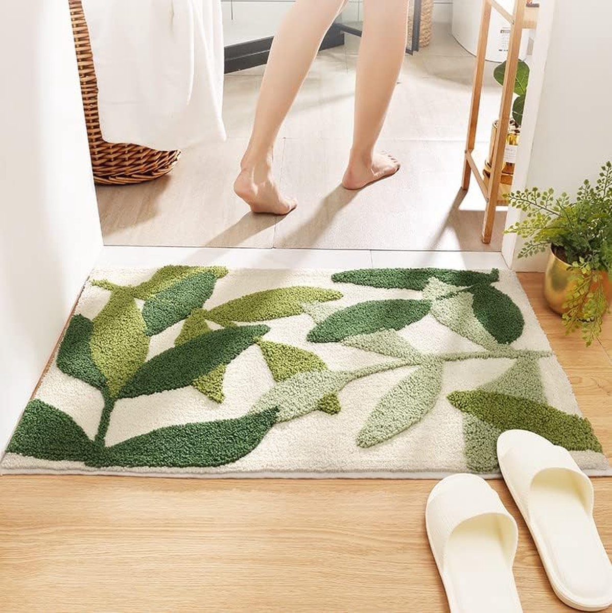 Close up of soft microfibre pile and green leaf pattern on a bath mat