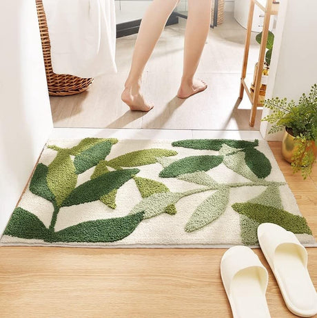 Close up of soft microfibre pile and green leaf pattern on a bath mat