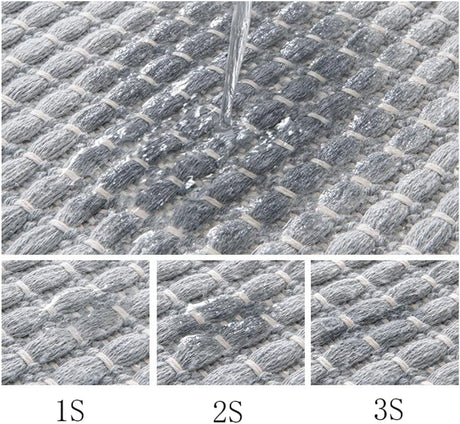 Tassel detail along the end of the beige braided bath mat