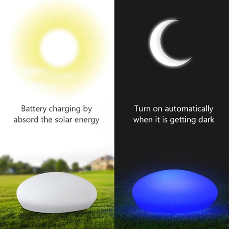 Solar cobblestone shaped garden light glowing in a flower bed