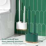 Dark green toilet plunger stored in the shared wall mounted holder