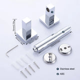 Square chrome toilet paper holder loaded with a standard roll