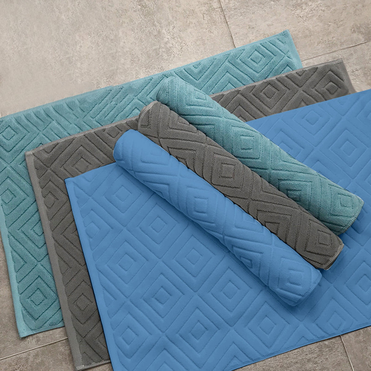 Two pack of white absorbent cotton bath mats folded and stacked