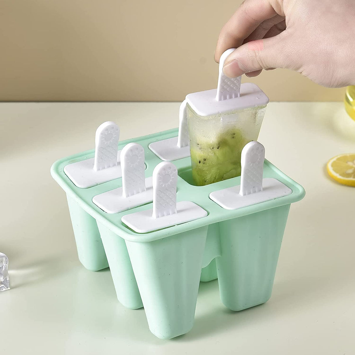 Green silicone six cavity ice pop mould with reusable sticks