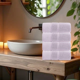 Cotton towel shown in use for drying hands and face