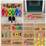 Floral entrance door mat with blue blooms and green foliage on brown