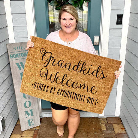 Floral print door mat with blue flowers on a brown ground