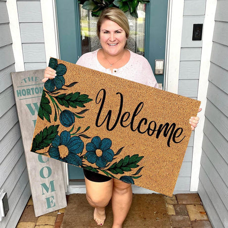 Floral print door mat with blue flowers on a brown ground