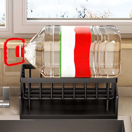 Dishcloth hanging from the towel rod on the black sink caddy