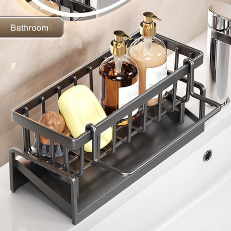 Sink caddy organiser used on a bathroom basin holding soap and a brush