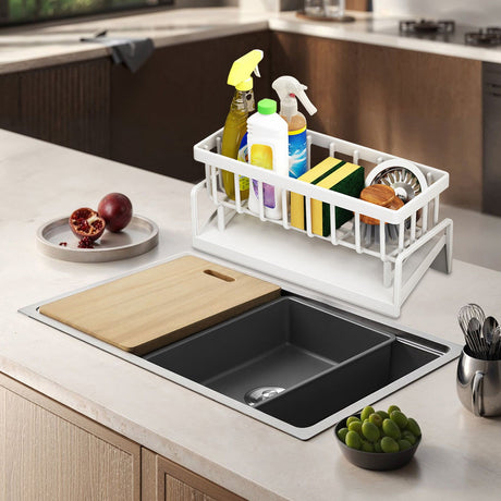Dishcloth hanging from the towel rod of the white sink caddy