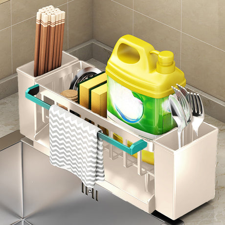 Dishcloth hanging from the towel rod of the beige sink caddy