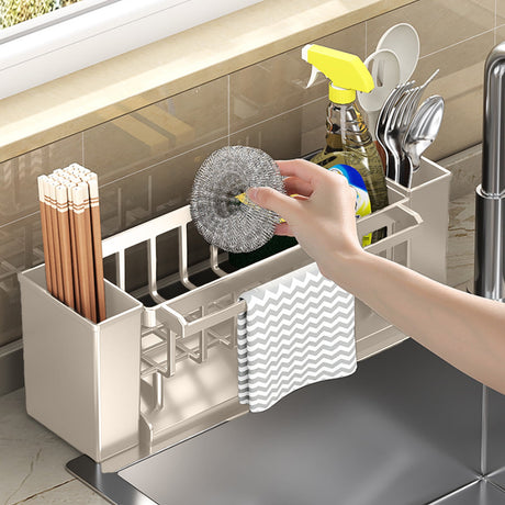 Detachable tray removed from the beige sink caddy for cleaning
