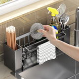 Detachable tray removed from the grey sink caddy for cleaning