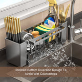 Sponges and brushes stored in the grey sink caddy tray