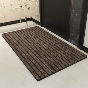 Coffee coloured absorbent door mat at a home entryway