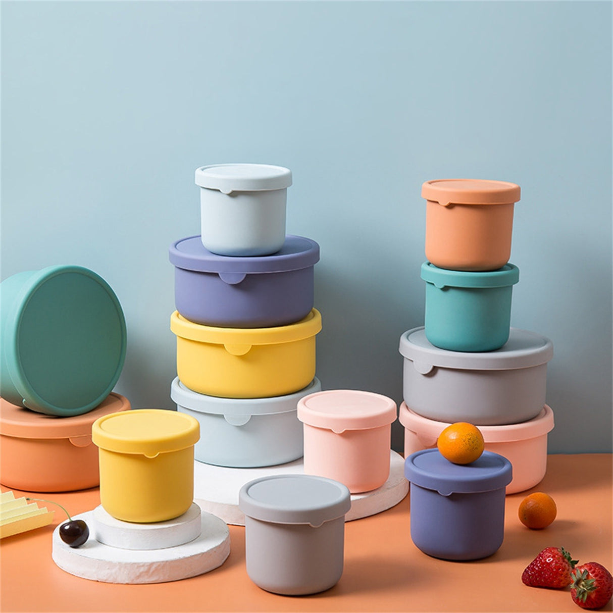 Blue reusable silicone baby snack container with lid