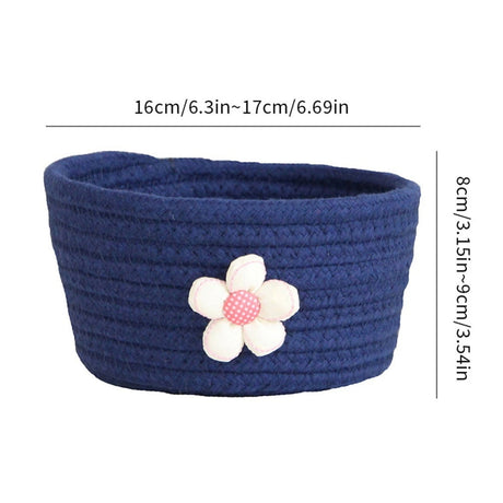 Shallow oval cotton rope basket on a shelf