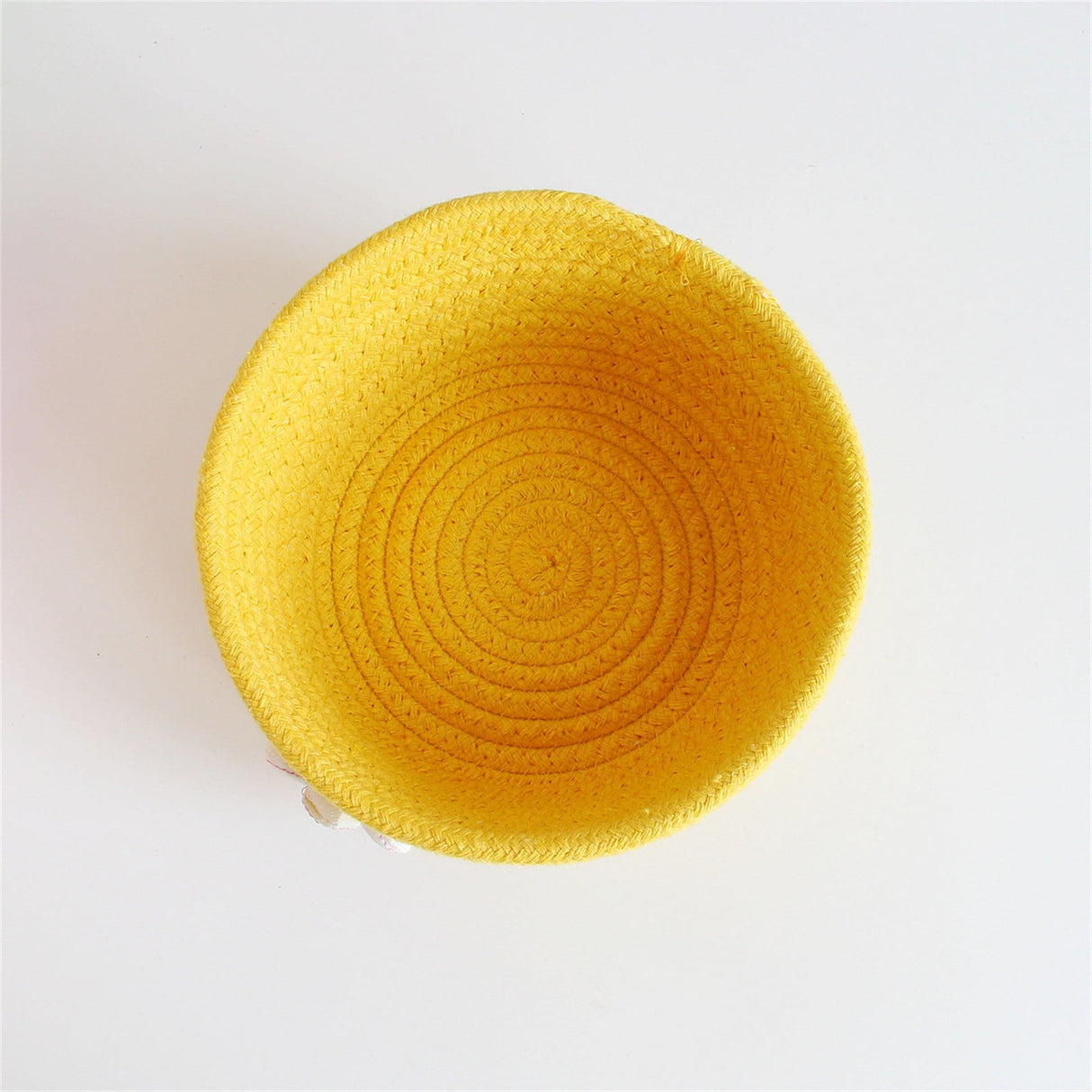 Woven cotton rope basket holding small items