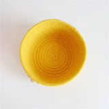 Woven cotton rope basket holding small items