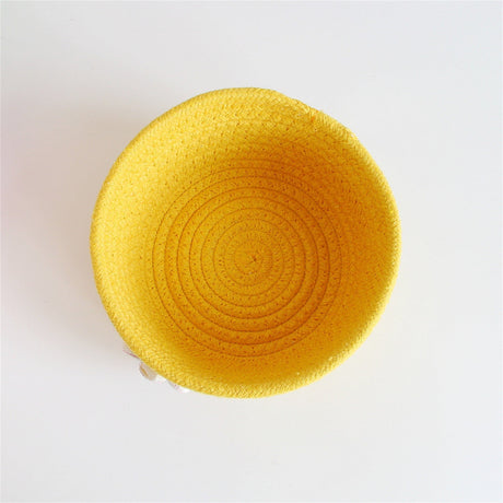 Woven cotton rope basket holding small items