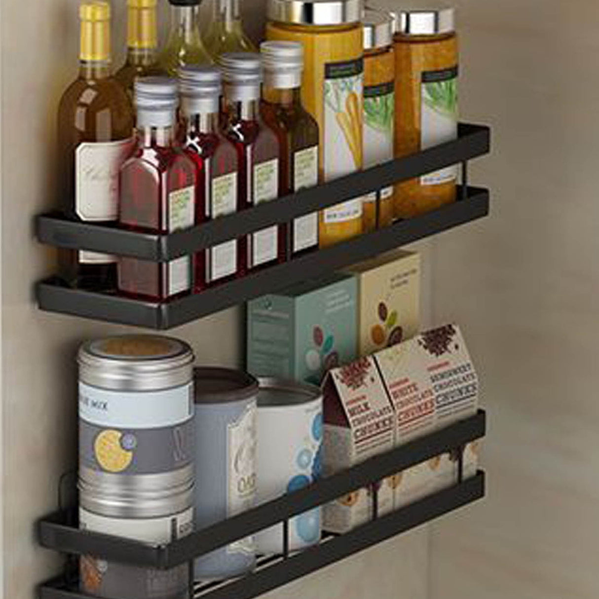 Adhesive shelf mounted on the inside of a cupboard door holding spice jars