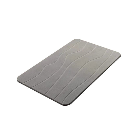 Close up of the soft diatomaceous earth surface and sleek cut edge of the grey mat