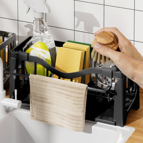 Sink sponge holder in use on a kitchen benchtop next to the tap