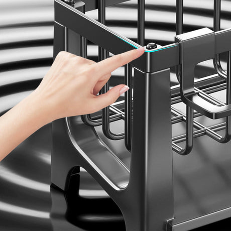 Compartments of the sink caddy holding assorted cleaning tools