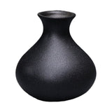 Compact black ceramic table vase with a matte finish