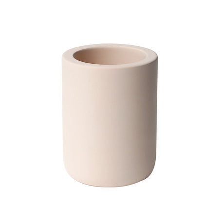 Beige diatomaceous earth drying stone toothbrush holder standing on a bathroom bench
