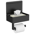 Matte black toilet paper holder with storage shelf mounted on a bathroom wall