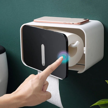 Covered toilet roll holder with paper feeding out from the bottom