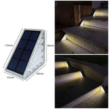 Triangular warm white solar step lights tucked into garden stair corners