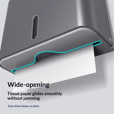 Grey paper towel dispenser opened for refilling with folded hand towels