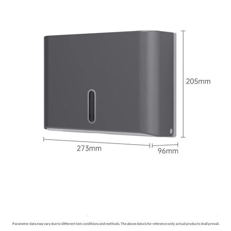 Grey towel dispenser mounted on a tiled washroom wall above a basin
