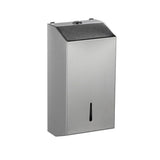 Stainless steel wall mounted paper towel dispenser in a washroom