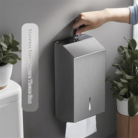 Paper towel being drawn from the base of the stainless steel dispenser