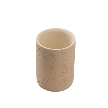 Ribbed artificial sandstone toothbrush holder cup standing on a bathroom countertop