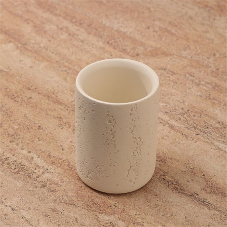 Close view of the vertical ribbed texture on the sandstone toothbrush cup