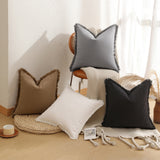 Close up of the textured brown fabric and fringed edge on the cushion cover