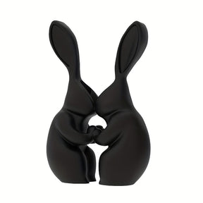 Black 3D printed bunny shaped vase with a ceramic look finish