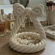 White bow-shaped jewellery tray with twisted rope detail