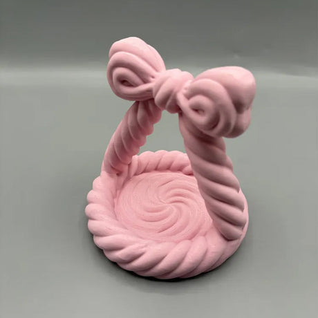 Pink bow-shaped jewellery tray with twisted rope detail