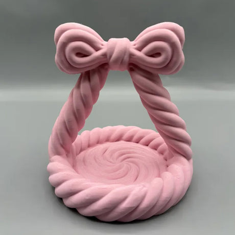 Pink bow-shaped jewellery tray with twisted rope detail