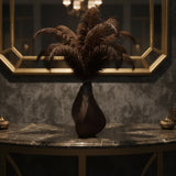 Sculptural black 3D printed vase with a contemplative form